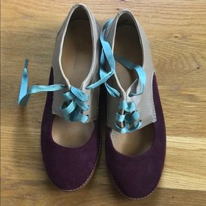 Purple suede and tan oxfords
